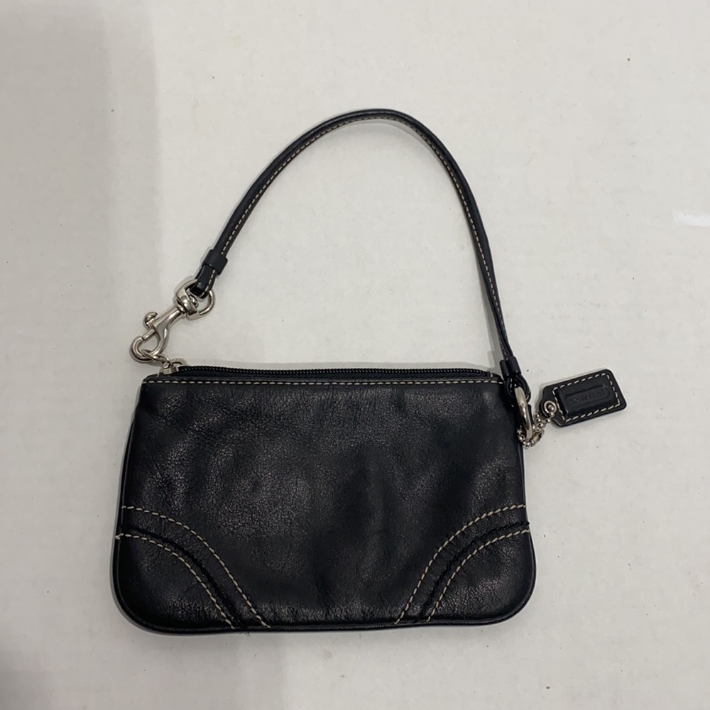 Coach || Woman’s black genuine leather wristlet 6”L x 4 H